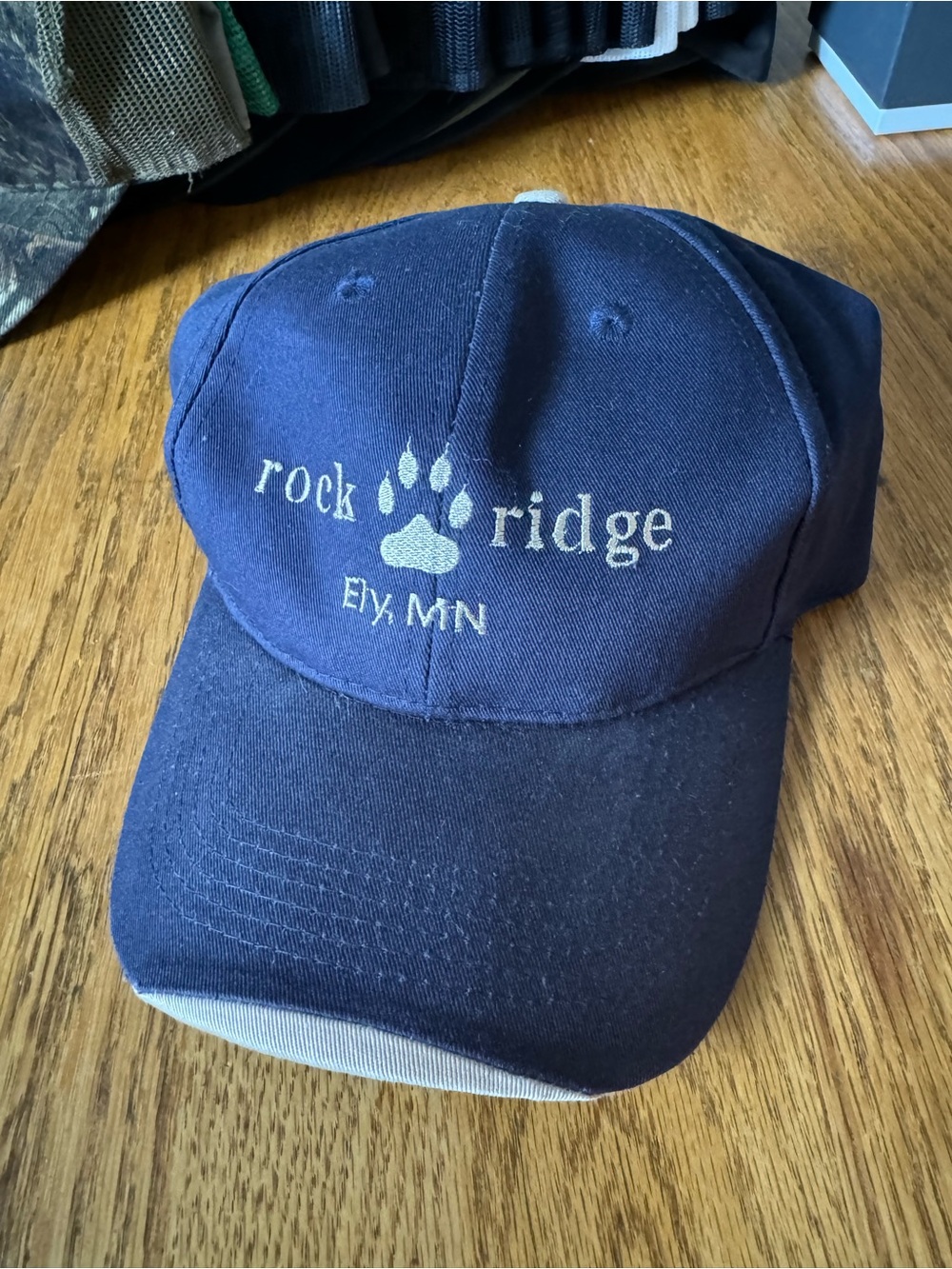Rock Ridge Ely MN Navy Baseball Cap with tan accents